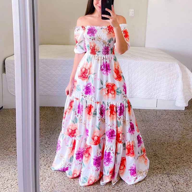 woman in mirror wearing a purple, and peach floral maxi dress